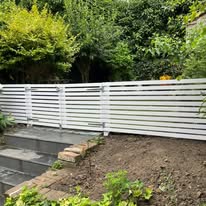 Decorative garden gate adding character and charm to the home’s entrance