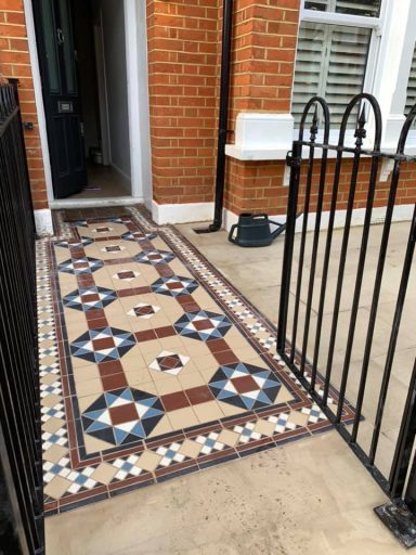Charming Victorian tile path leading to the front door, enhancing the entrance of the home