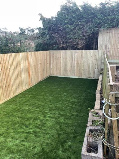 Minimalist garden featuring a full area of artificial lawn for low maintenance and aesthetic appeal